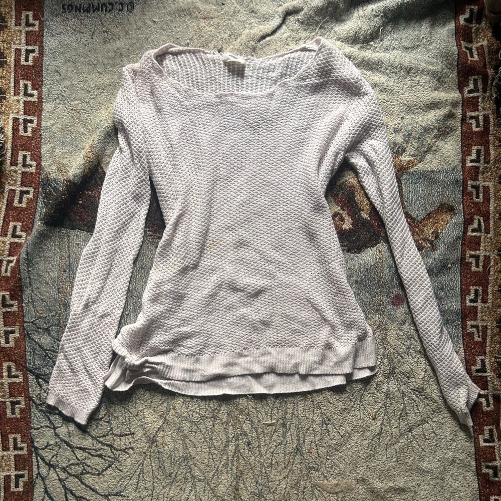 Cream and white knitted cropped sweater with a distressed, grunge-inspired look